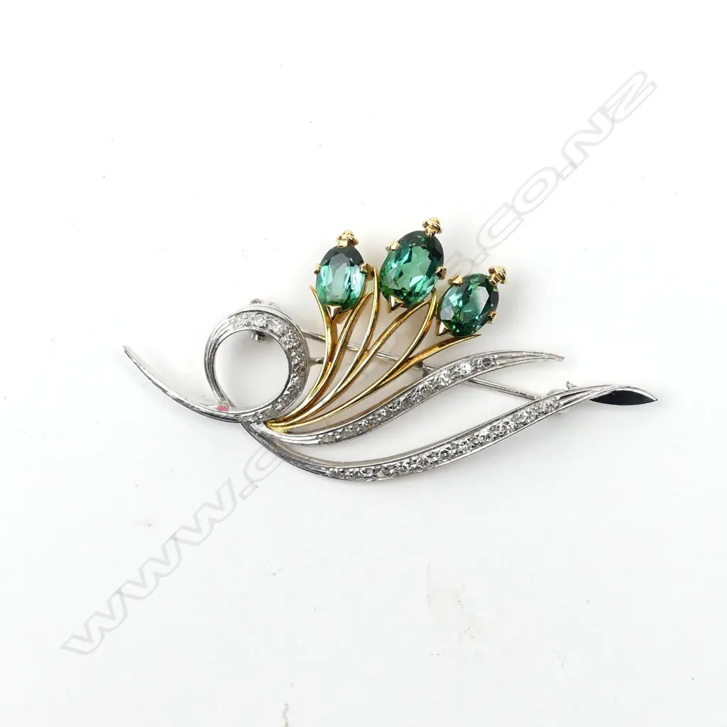 An 18ct yellow and white gold diamond and tourmaline brooch Image 1++