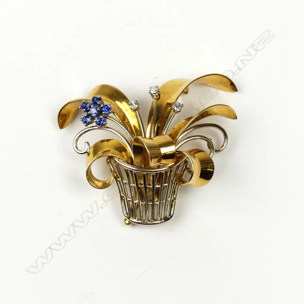 A vintage 18ct. yellow gold sapphire and diamond flowering basket form brooch Image 1++