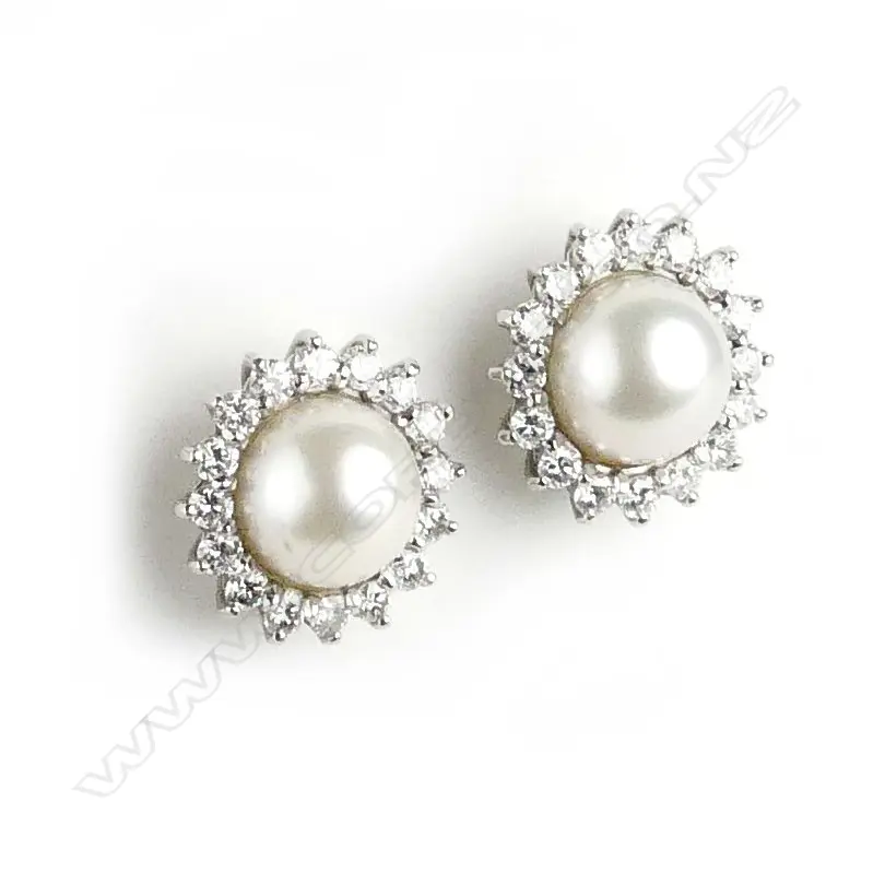 A pair of handmade platinum pearl and diamond cluster stud earrings Image 1++