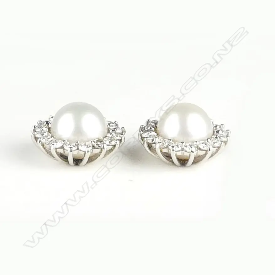 A pair of handmade platinum pearl and diamond cluster stud earrings Image 1++