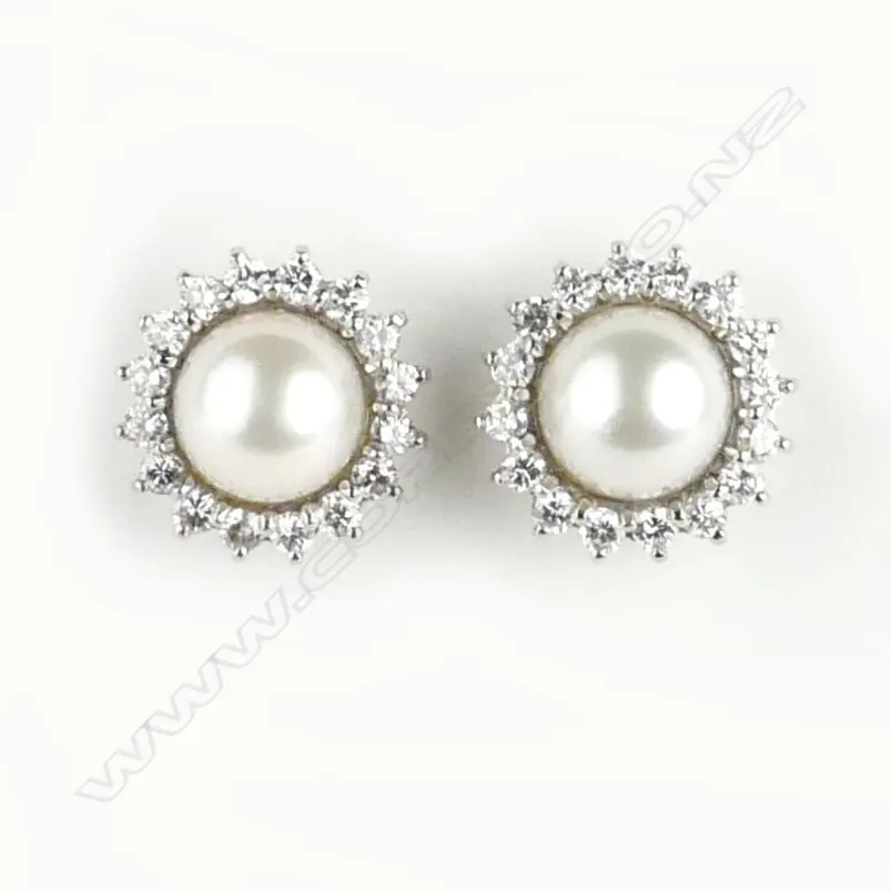 A pair of handmade platinum pearl and diamond cluster stud earrings Image 1++