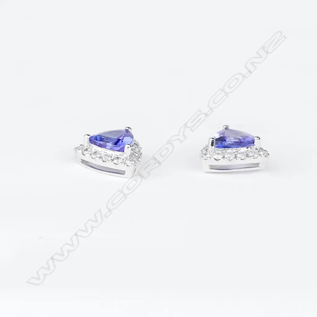 A pair of 14ct white gold tanzanite and diamond earrings Image 1++
