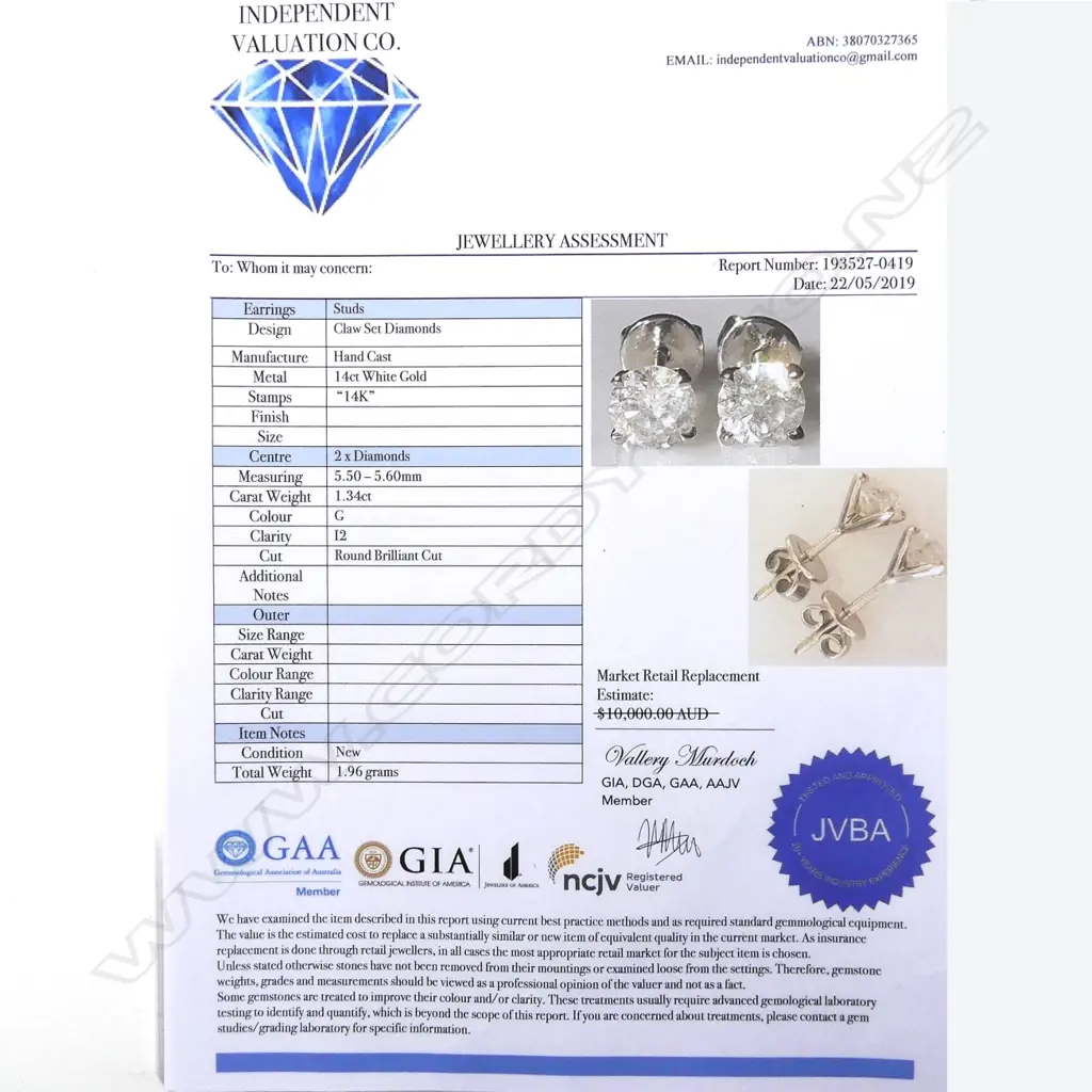 A pair of 14ct white gold and diamond stud earrings Image 1++