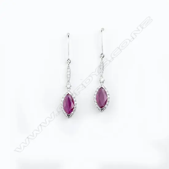 A pair of 14ct white gold diamond and ruby earrings