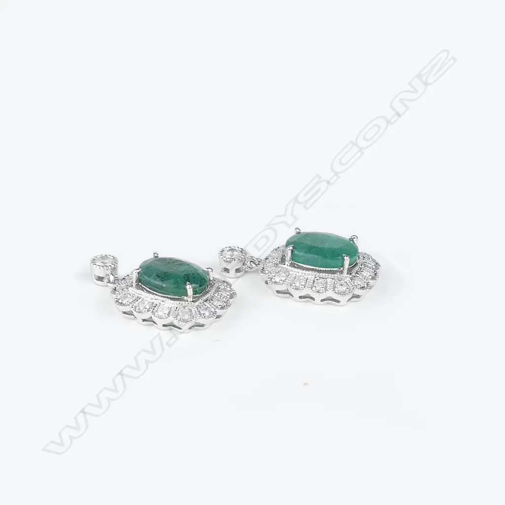 A pair of 14ct white gold emerald and diamond earrings Image 1++