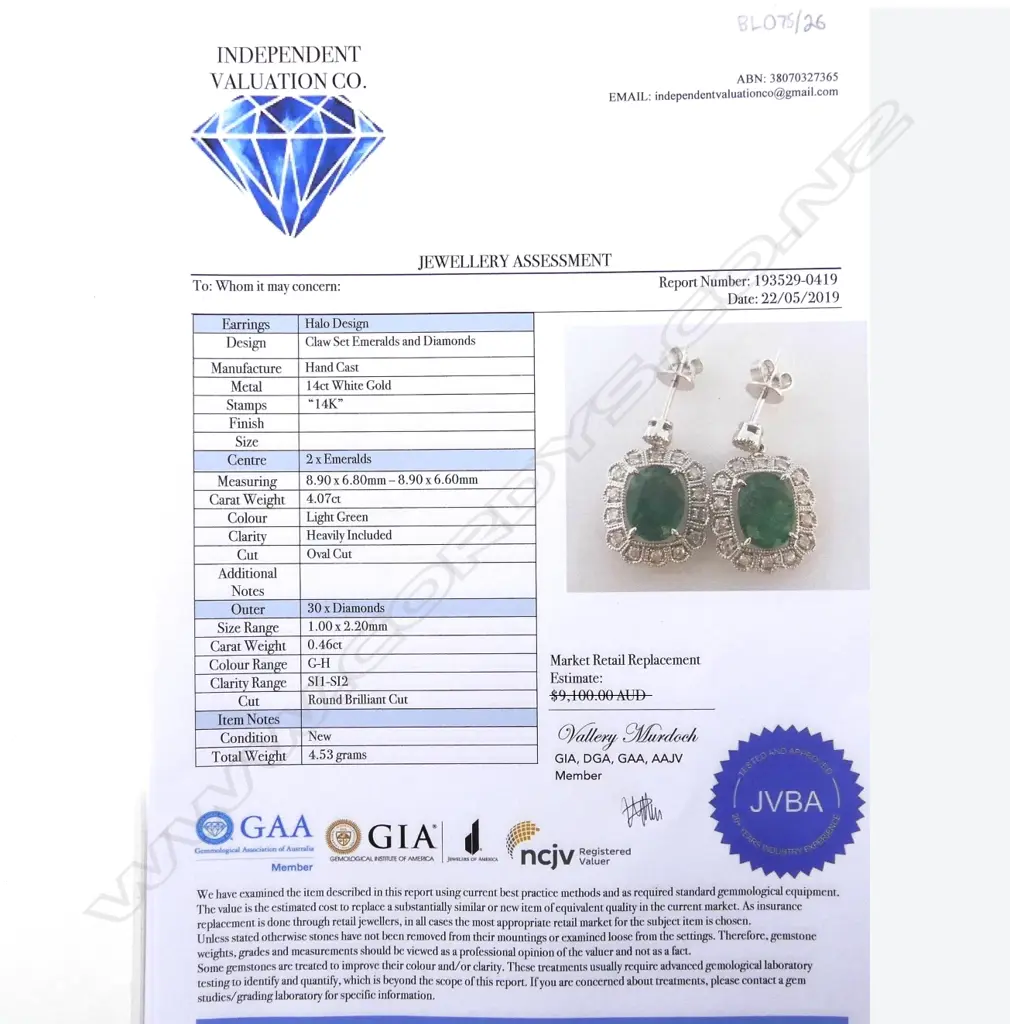 A pair of 14ct white gold emerald and diamond earrings Image 1++