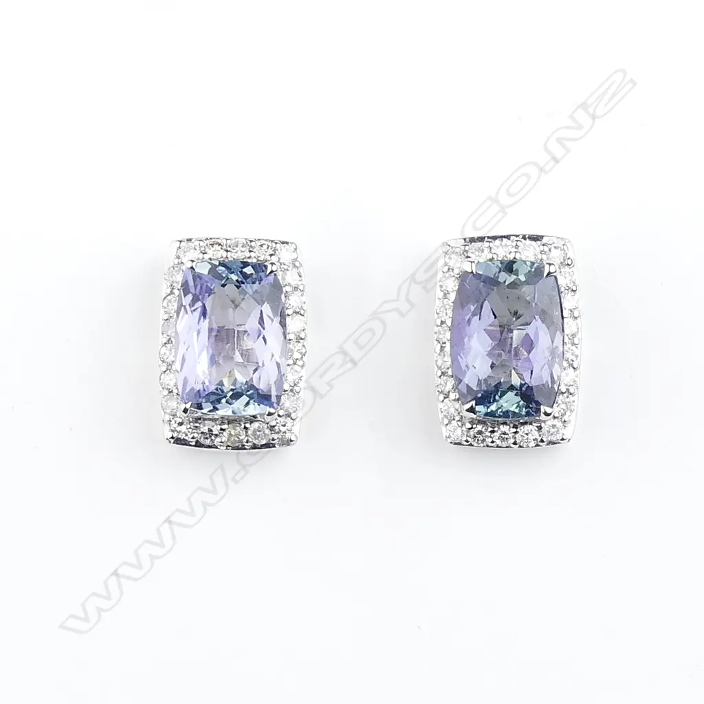 A pair of 14ct white gold sapphire and diamond stud earrings Image 1++
