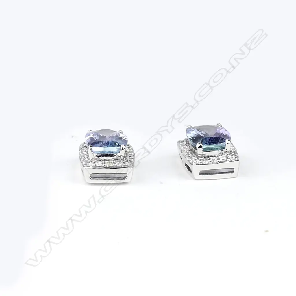 A pair of 14ct white gold sapphire and diamond stud earrings Image 1++