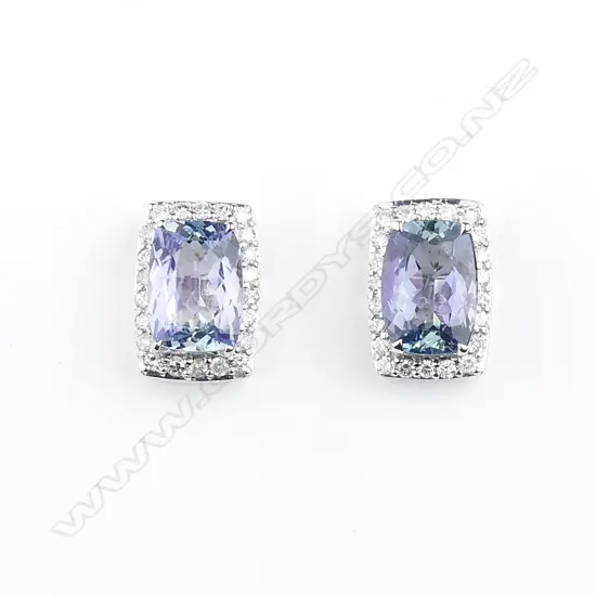 A pair of 14ct white gold sapphire and diamond stud earrings