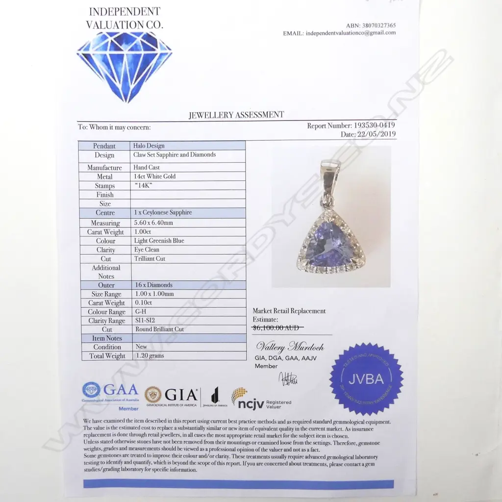 A 14ct white gold sapphire and diamond pendant Image 1++