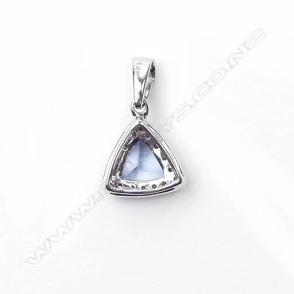 A 14ct white gold sapphire and diamond pendant Image 1++