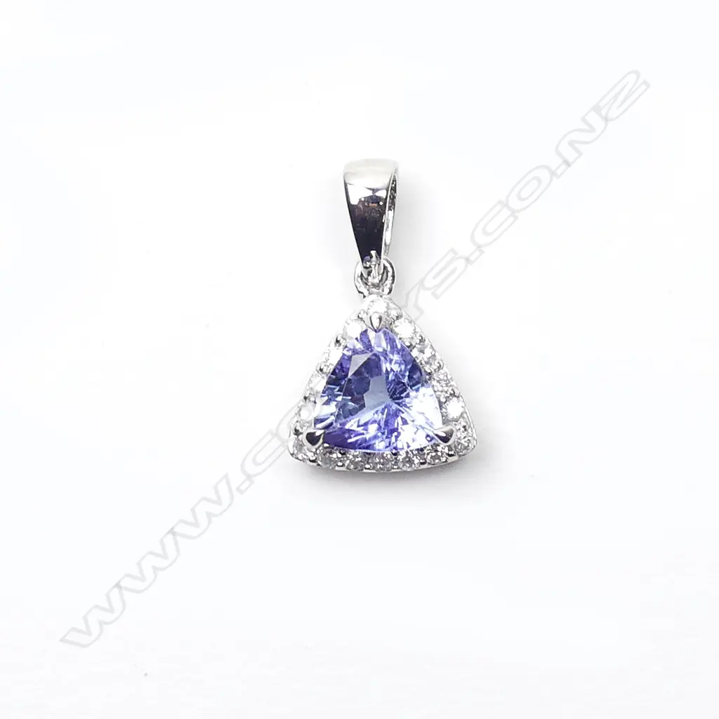 A 14ct white gold sapphire and diamond pendant Image 1++