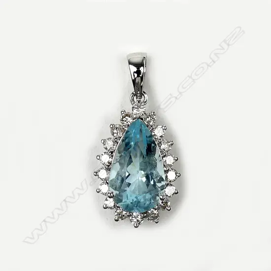 A 14ct white gold aquamarine and diamond pendant