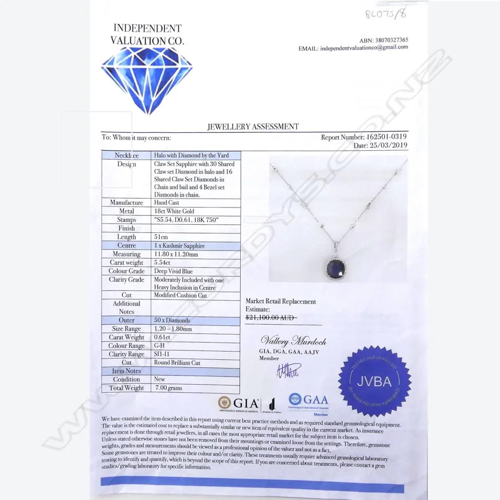 An 18ct white gold sapphire and diamond pendant Image 1++
