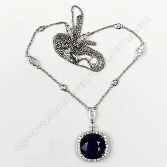 An 18ct white gold sapphire and diamond pendant