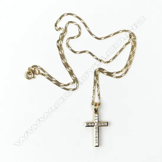 A vintage 9ct. yellow gold and diamond set cross on gold chain
