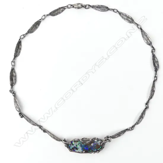 A vintage hand crafted silver and opal necklace