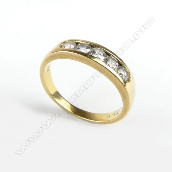 A vintage handmade 18ct. yellow gold and five stone diamond ring
