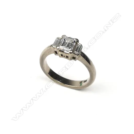An 18ct white gold and three stone diamond ring