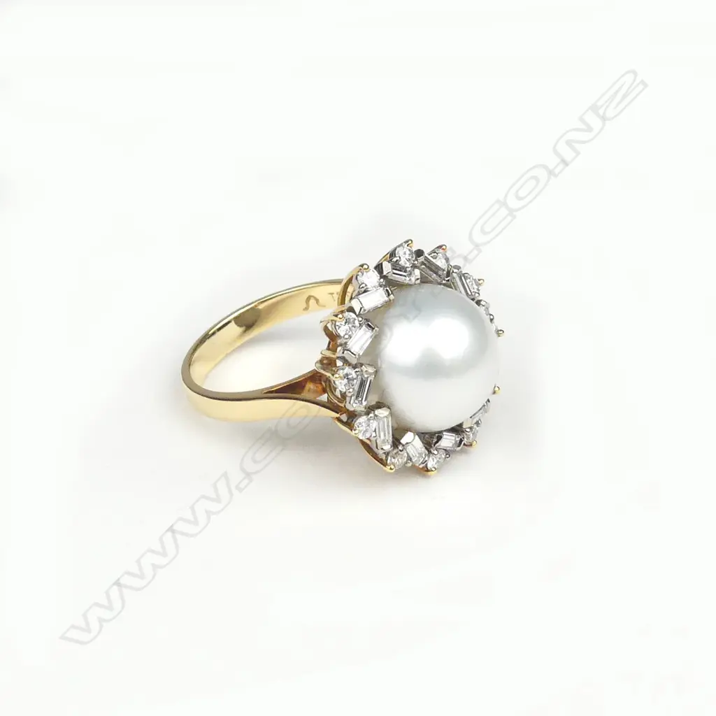 A lady's 18ct. white gold pearl and diamond cluster ring Image 1++