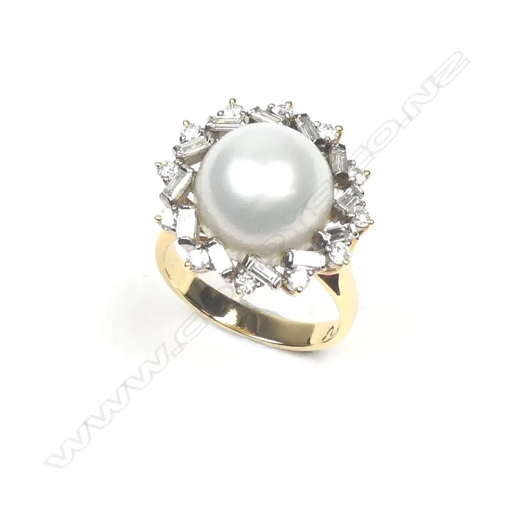 A lady's 18ct. white gold pearl and diamond cluster ring Image 1++