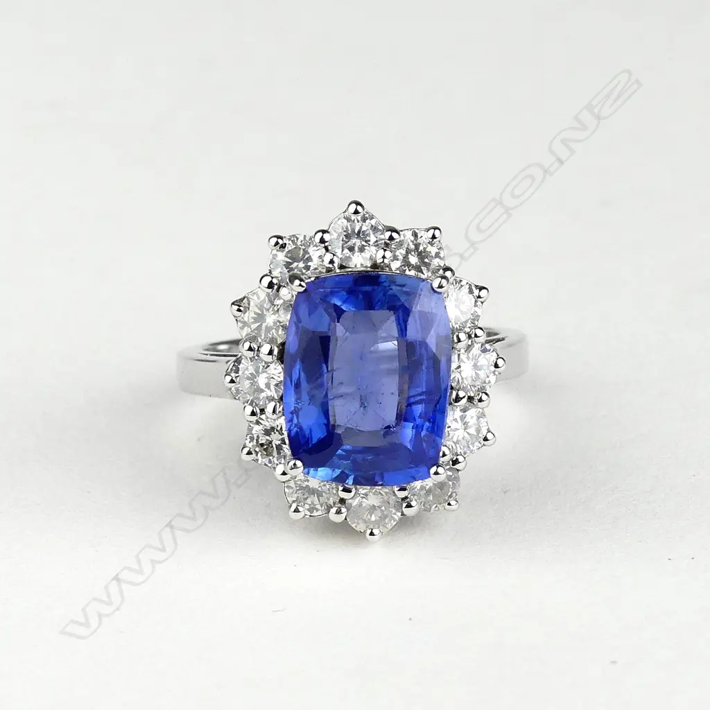 A 14ct white gold sapphire and diamond ring Image 1++