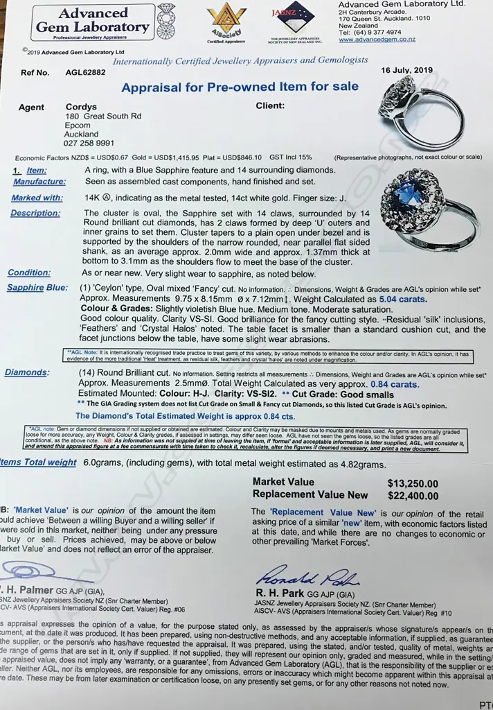 A 14ct white gold sapphire and diamond cluster ring Image 1++