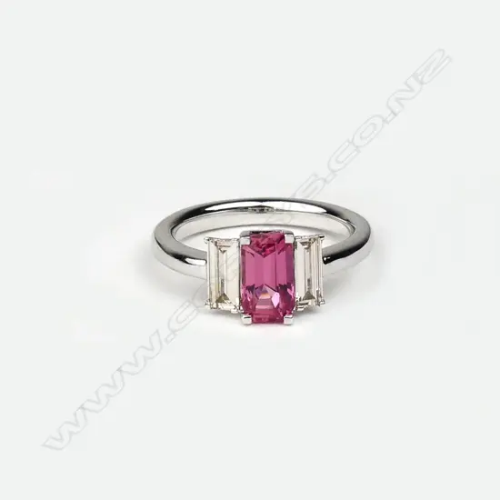 A platinum diamond and padparadscha (natural pink sapphire) ring