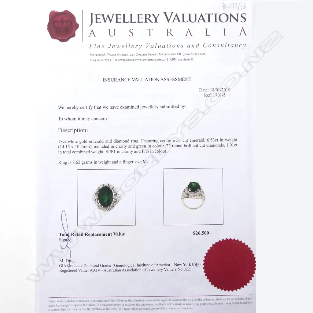 An 18ct white gold emerald and diamond ring Image 1++
