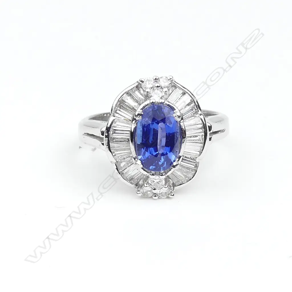 A platinum sapphire and diamond ring Image 1++