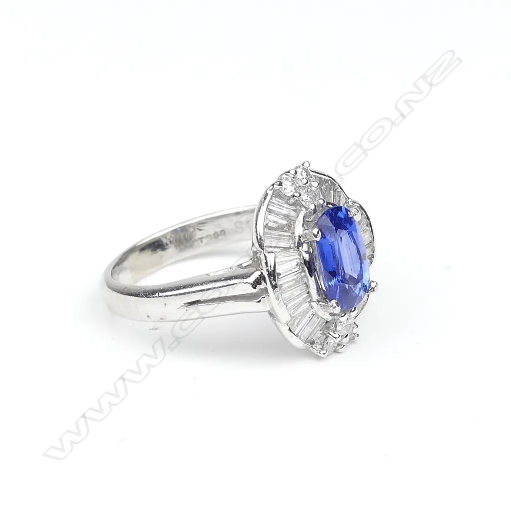 A platinum sapphire and diamond ring Image 1++