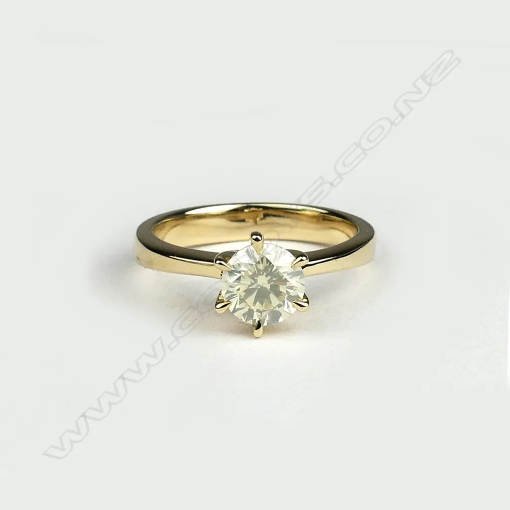 A 14ct gold diamond solitaire ring Image 1++