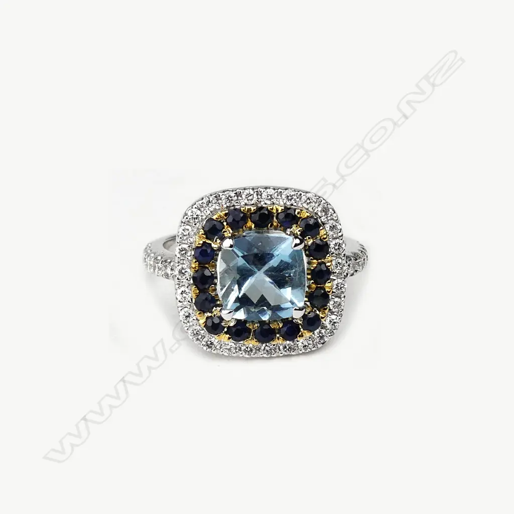 An 18ct white gold aquamarine diamond and sapphire ring Image 1++