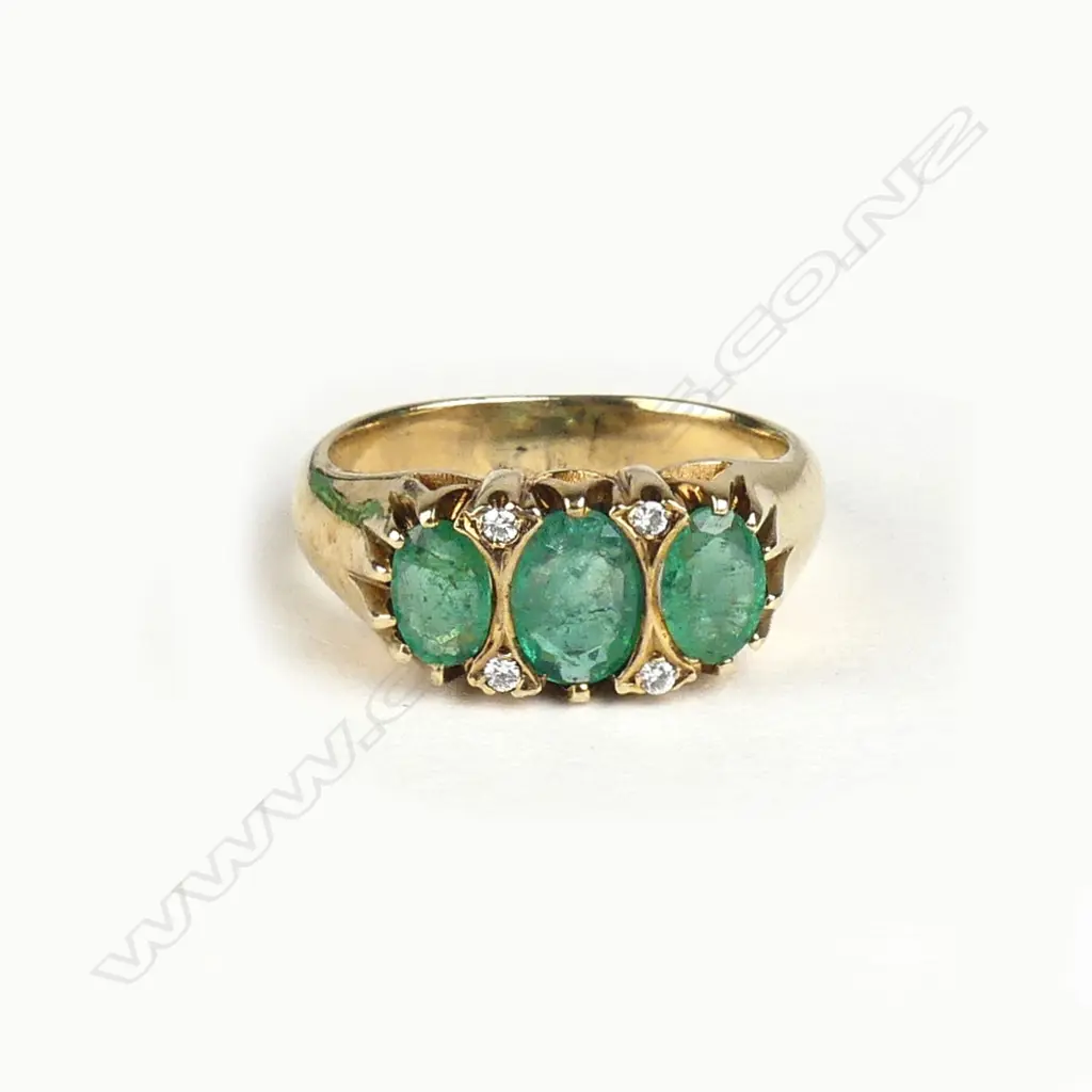 A 9ct gold emerald and diamond ring Image 1++