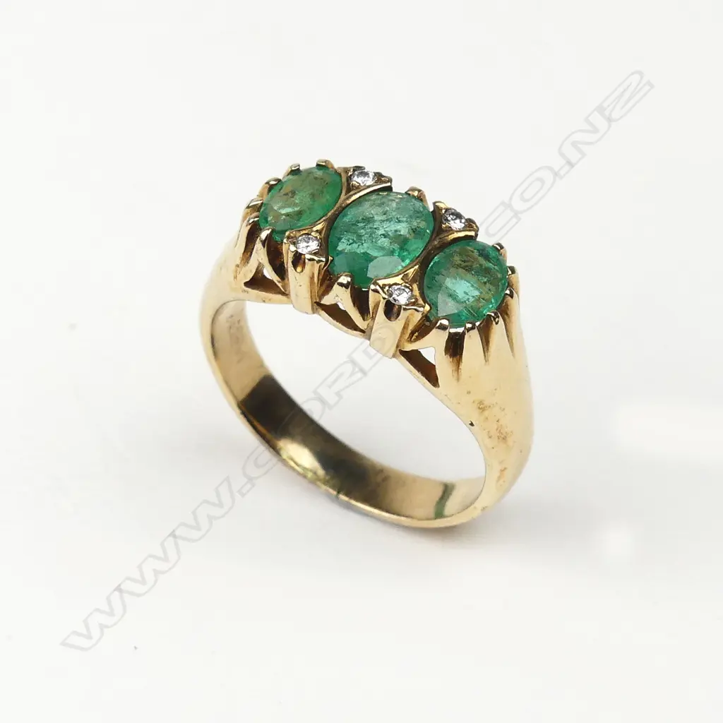 A 9ct gold emerald and diamond ring Image 1++