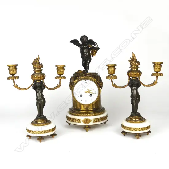 An impressive French mantel clock and garniture