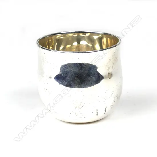 A small silver beaker