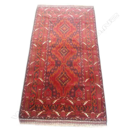 A hand knotted Baluchi rug