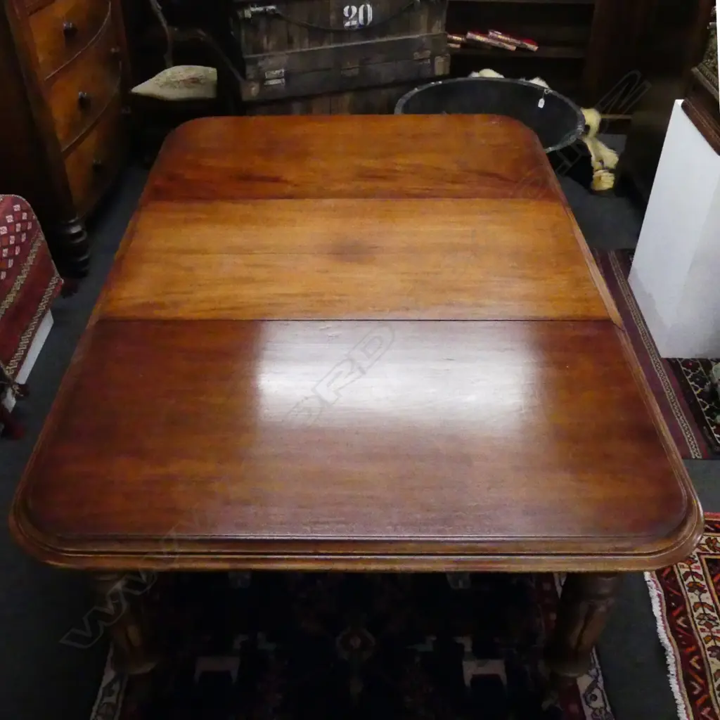A Victorian mahogany banquet extension dining table Image 1++
