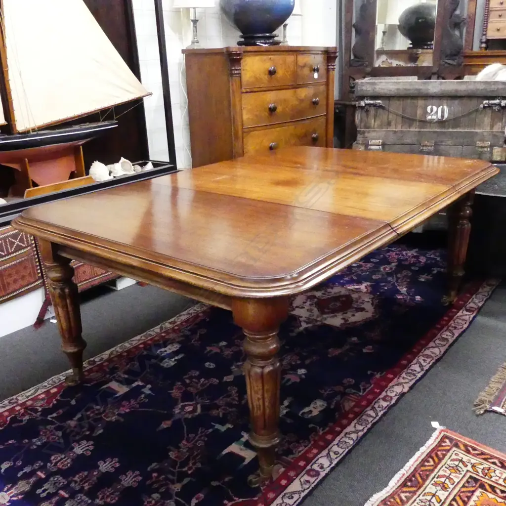 A Victorian mahogany banquet extension dining table Image 1++