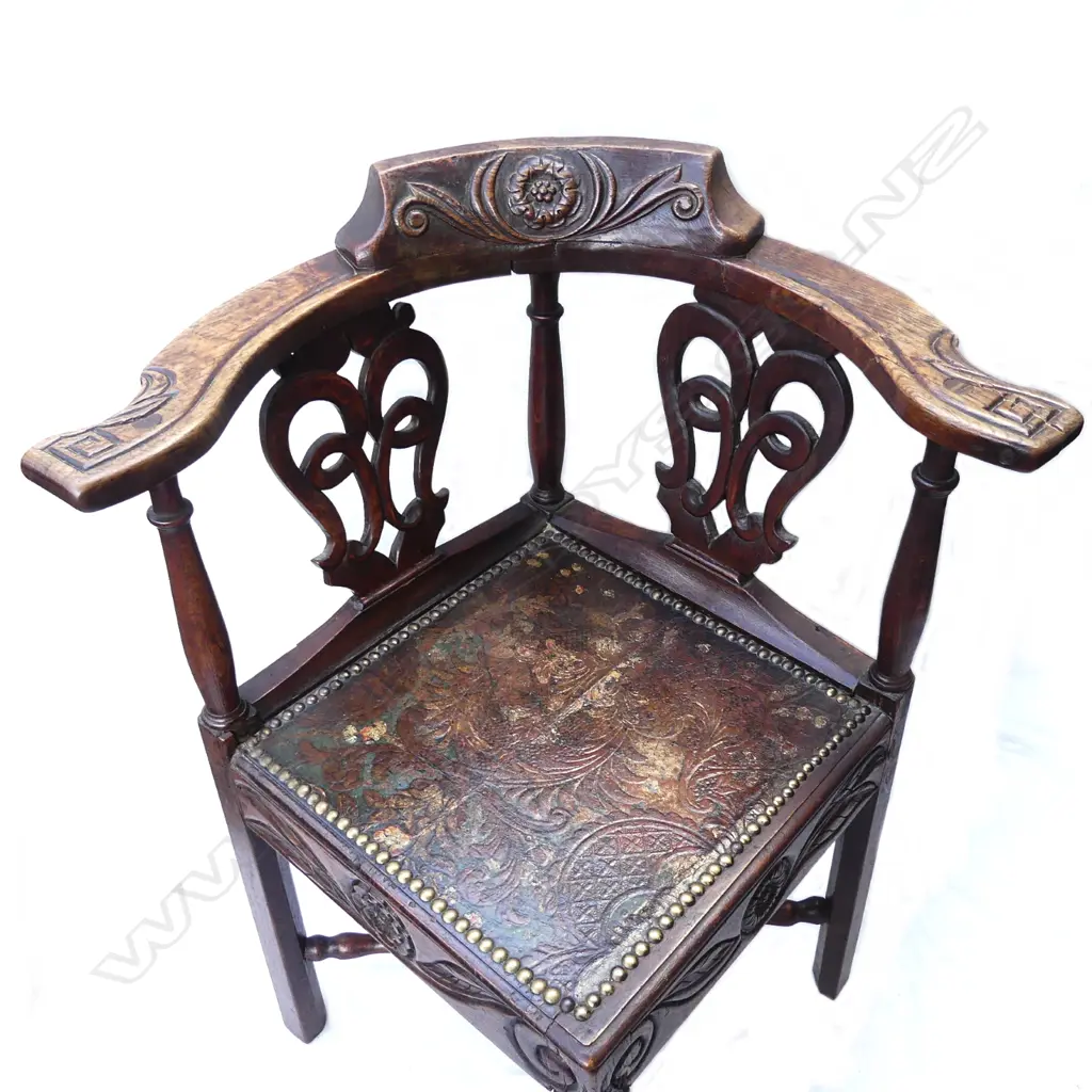 A carved oak corner chair Image 1++