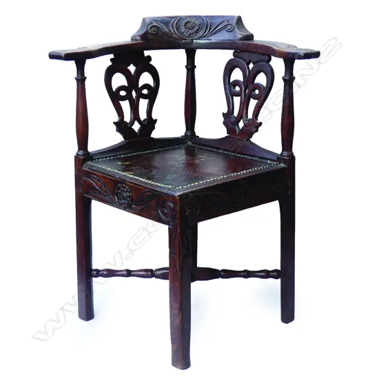 A carved oak corner chair