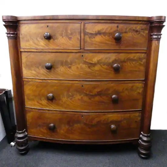 A Victorian mahogany five drawer bow front chest