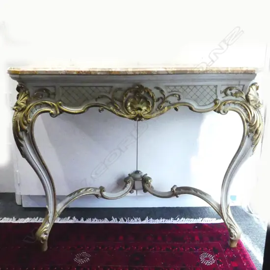 A Louis XV style parcel gilt marble topped console table