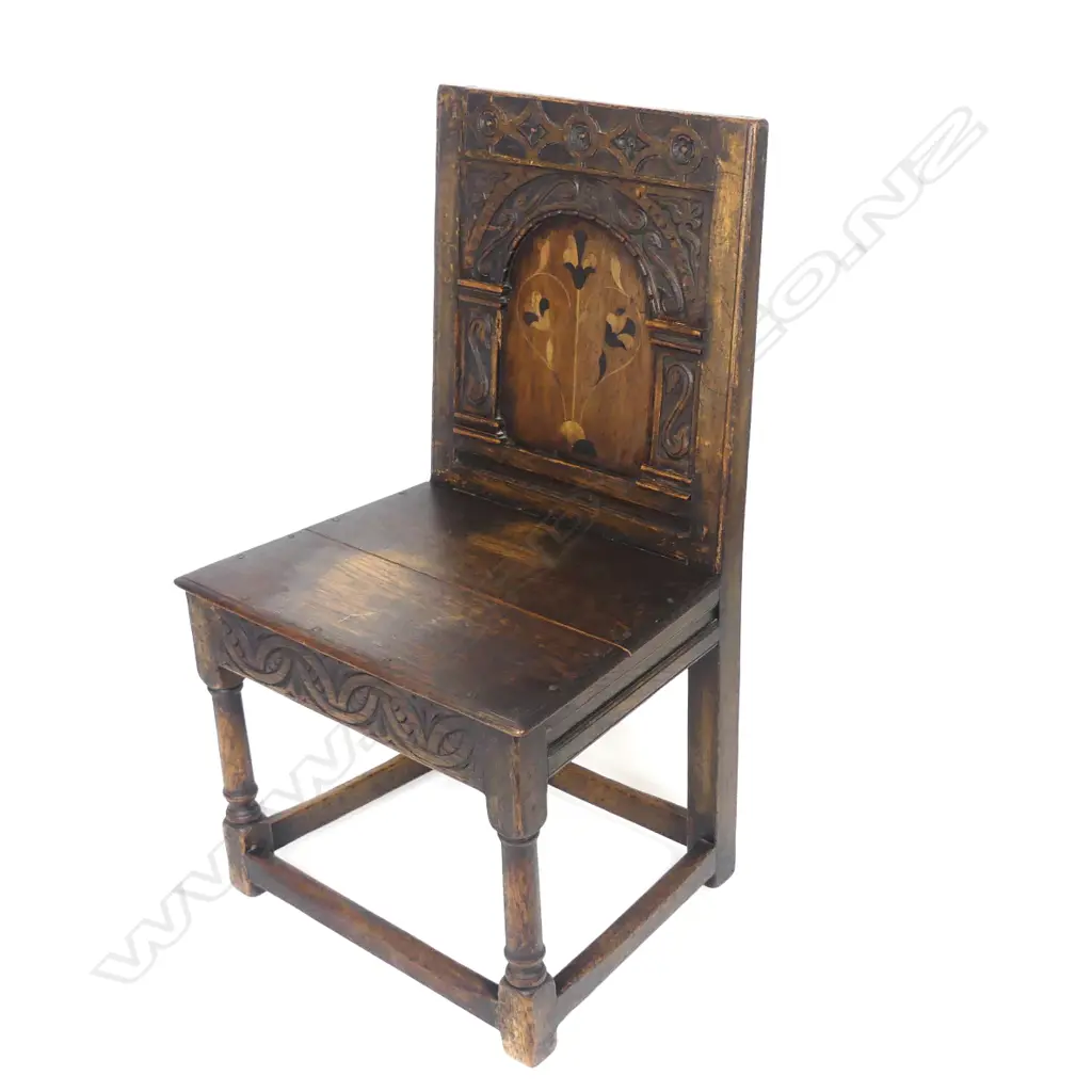 An inlaid and carved oak hall chair Image 1++