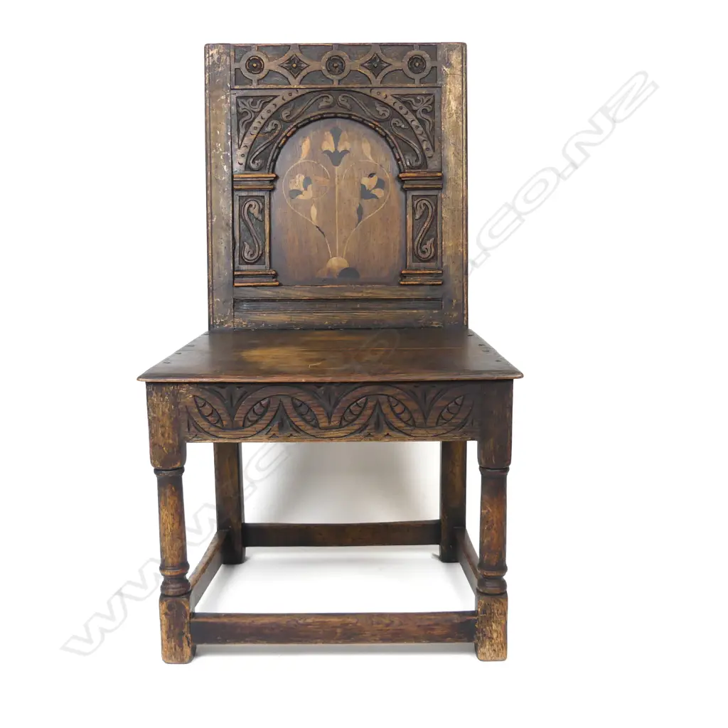 An inlaid and carved oak hall chair Image 1++