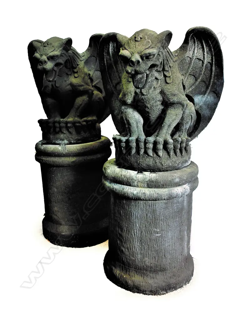A pair of large seated house entrance gargoyles on plinths Image 1++