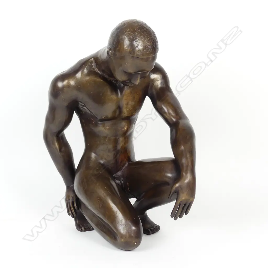 A bronze sculpture of a young man Image 1++
