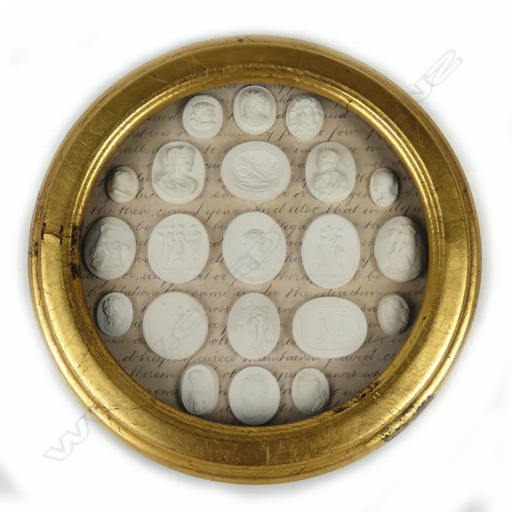 A circular gilt framed collection of small plaster cameo and intaglio plaques Image 1++