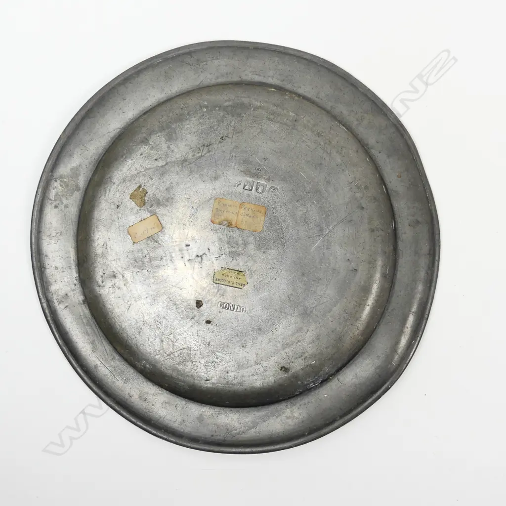 An 18thC pewter plate and a 19thC pewter charger Image 1++